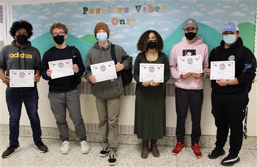 6 students holding award for Positive Vibes 